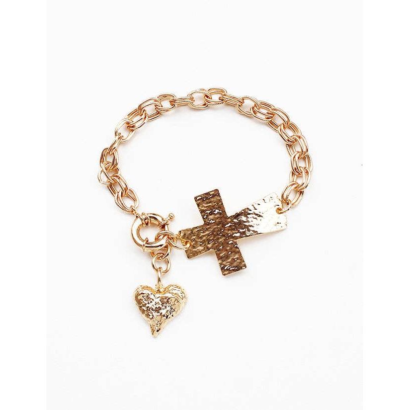 Gold chain bracelet with cross and heart charms on a white background