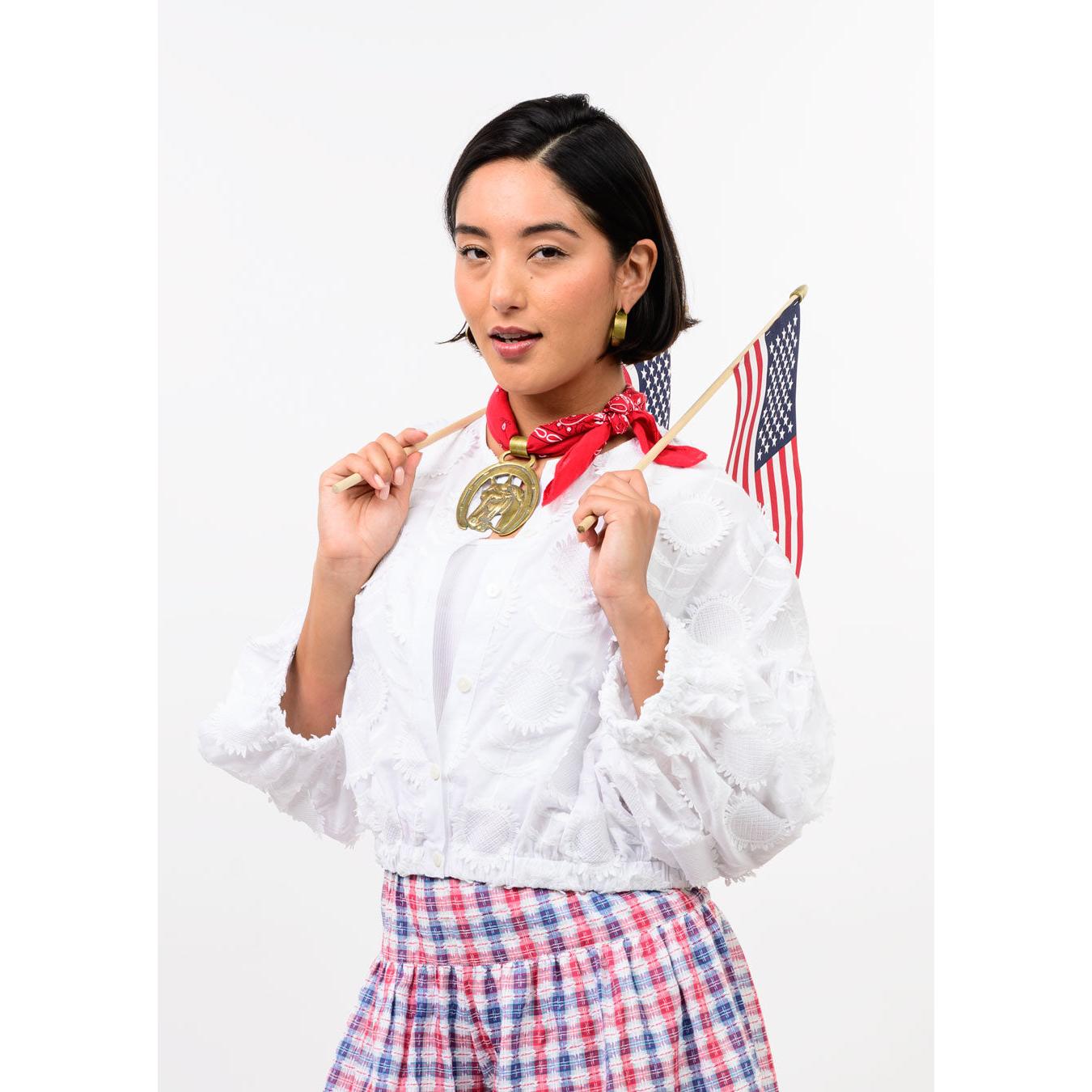 Close-up of the pleated detailing and pointed collar on the white Ivy Jane Sundance Jacket.
