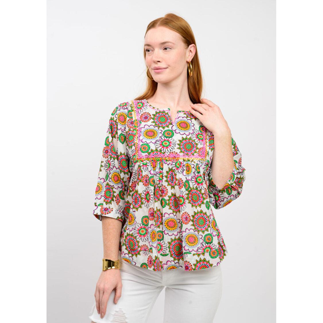 The voluminous puff sleeve and intricate floral pattern of the Ivy Jane Abundant Colors top.
