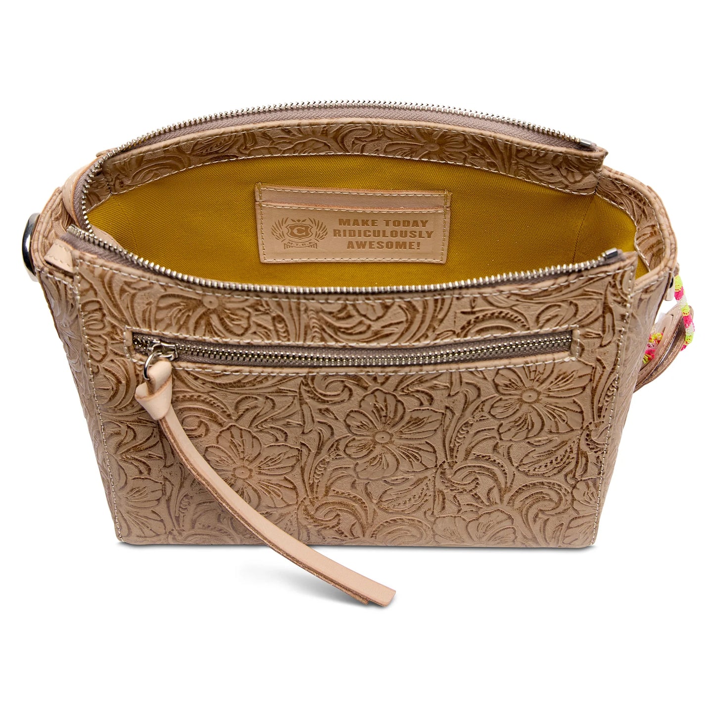 Consuela Lawton City Bag shown with its adjustable, multi-colored woven crossbody strap attached.