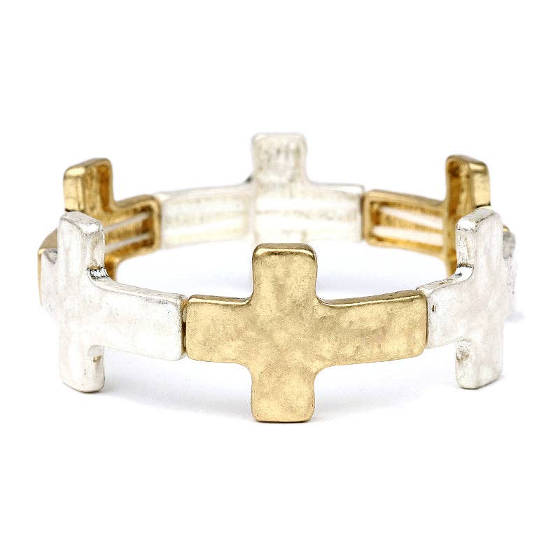 Two gold and silver cross-shaped rings on a white background