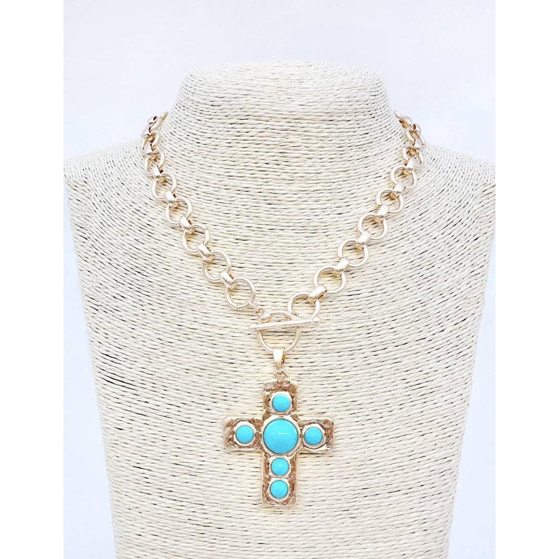 Necklace with a cross pendant featuring turquoise stones on a white background