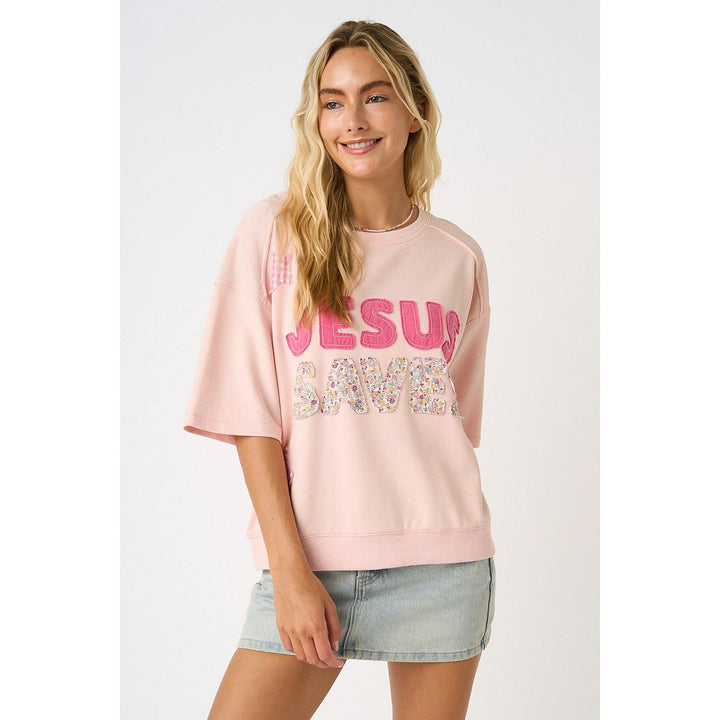Mittoshop Icy Pink Knit Top featuring "Jesus Saves" lettering, star patches, and floral patchwork details.