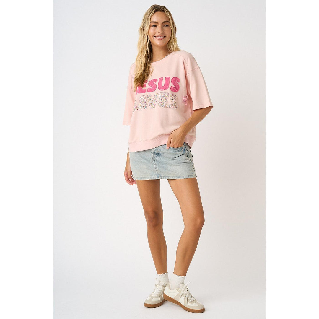 Mittoshop Icy Pink Knit Top featuring "Jesus Saves" lettering, star patches, and floral patchwork details.