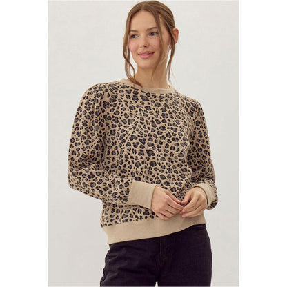 Woman wearing a leopard print sweater 
