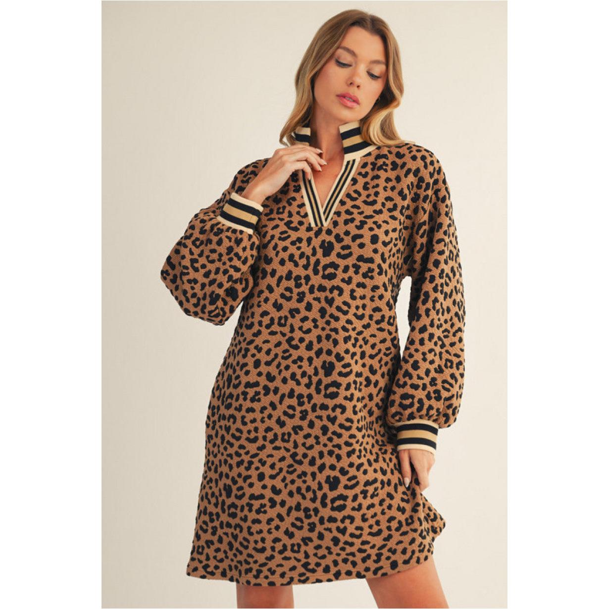 Woman wearing a leopard print dress with long sleeves