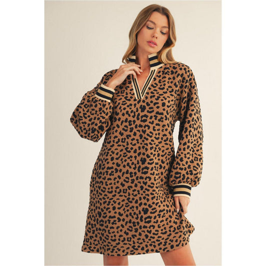 Woman wearing a leopard print dress with long sleeves