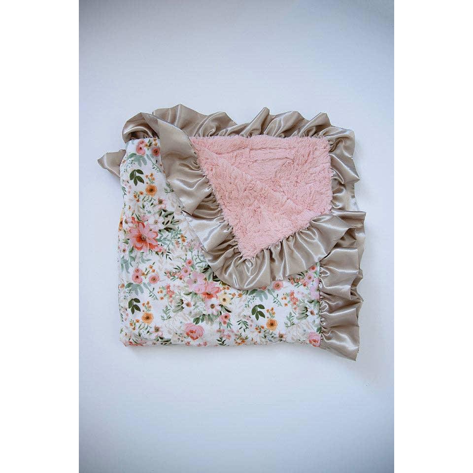 Rockin Royalty Juliette Luxe Cuddle Blanket; featuring a blush floral print and a wide pink satin ruffled border.
