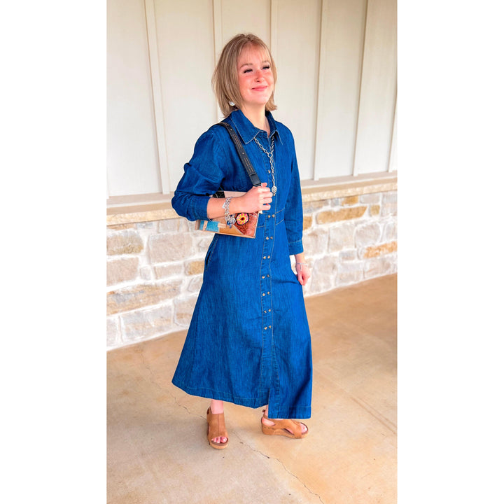 Model wearing the Uncle Frank indigo Tencel denim shirtwaist dress featuring a classic button-up front and a relaxed fit.