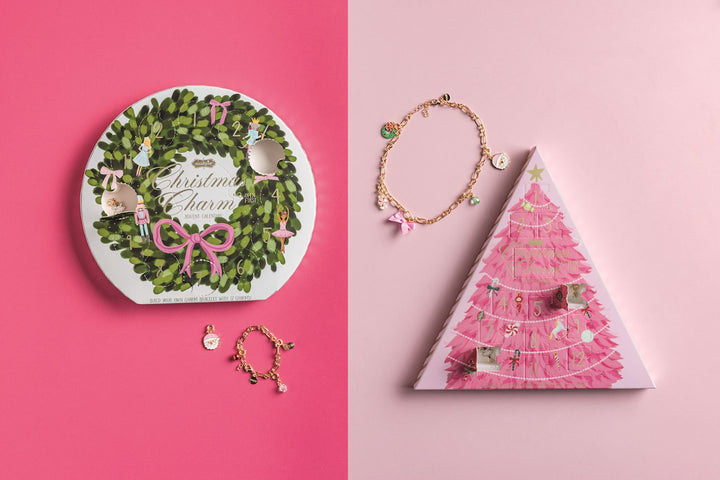 Mud Pie Christmas charm advent calendar sets featuring a gold chain necklace and daily enamel and rhinestone charms, available in tree and wreath styles.