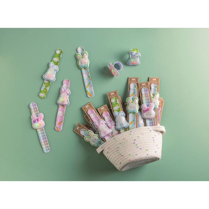 Easter Light-Up Slap Bracelets in animal patterns with LED characters in a cotton rope display basket.