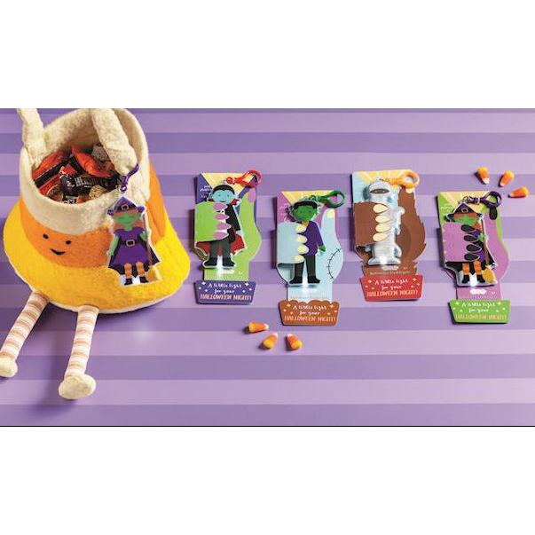 Assortment of Mud Pie vinyl Halloween character flashlight keychains featuring Frankenstein, Mummy, Vampire, and Witch designs.