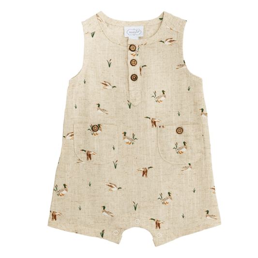 Infant Duck Shortall in tan featuring coconut wood buttons and hip pockets on a white background.