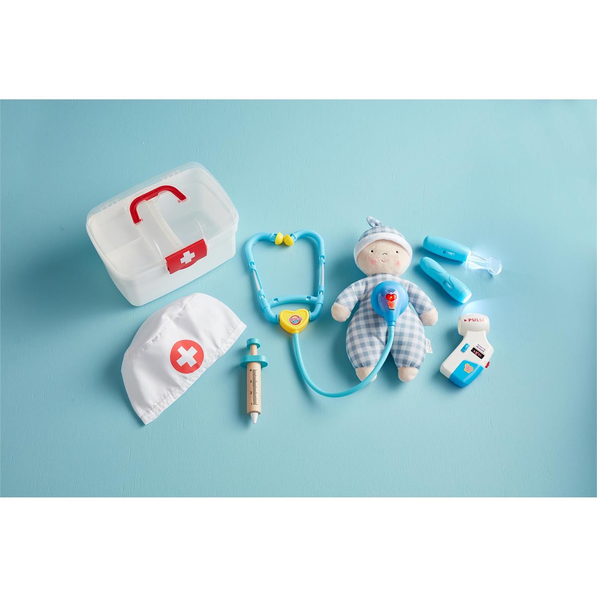 Close-up of the 8-piece doctor kit components, including the light-up tool and dress-up hat.