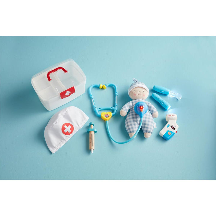 Close-up of the 8-piece doctor kit components, including the light-up tool and dress-up hat.