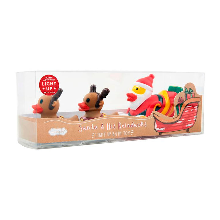Mud Pie 3-piece holiday bath toy set featuring a light-up Santa sleigh and two reindeer ducks in a bathtub.