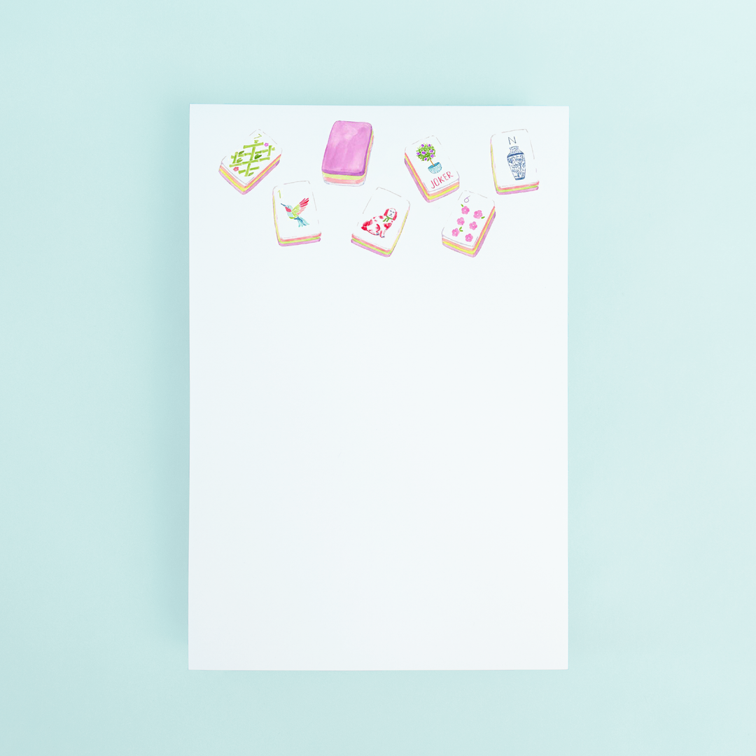 Watercolor illustration of colorful Mahjong tiles at the top of a white 4x6 notepad by Taylor Paladino.