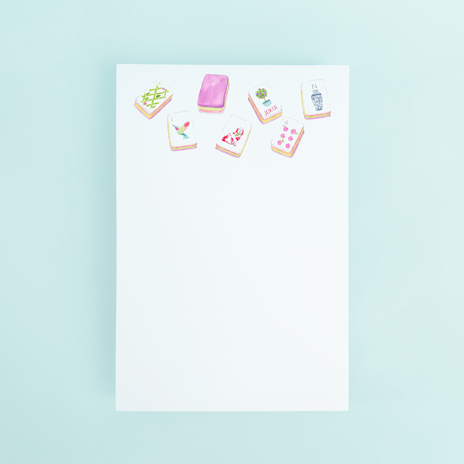 Watercolor illustration of colorful Mahjong tiles at the top of a white 4x6 notepad by Taylor Paladino.