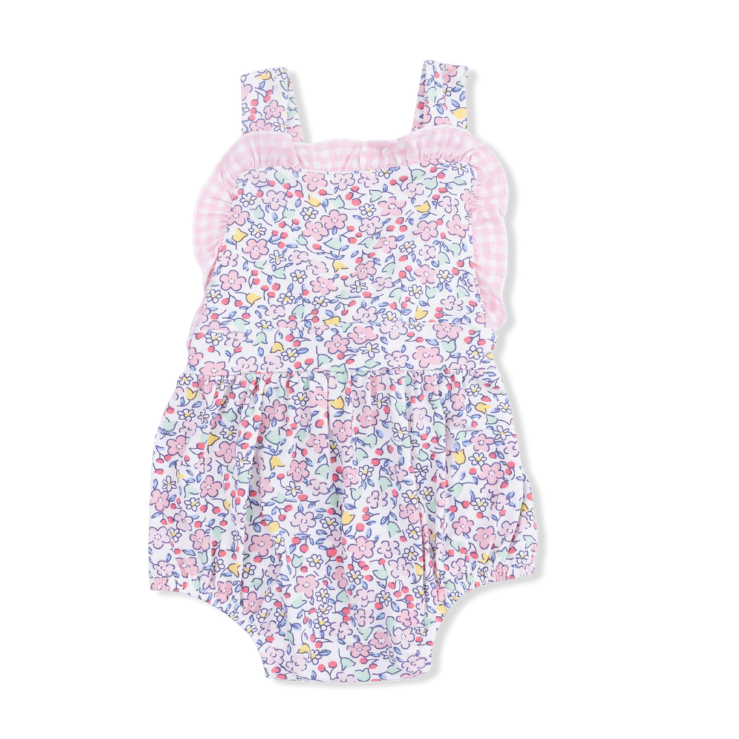 Baby girl wearing a pink and purple floral Elizabeth's Garden bamboo ruffle bubble romper.