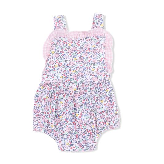 Baby girl wearing a pink and purple floral Elizabeth's Garden bamboo ruffle bubble romper.