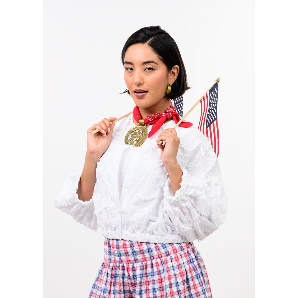 Close-up of the pleated detailing and pointed collar on the white Ivy Jane Sundance Jacket.