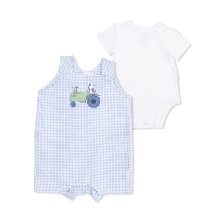Baby boy blue and white bamboo overall set with cow driving a tractor applique.