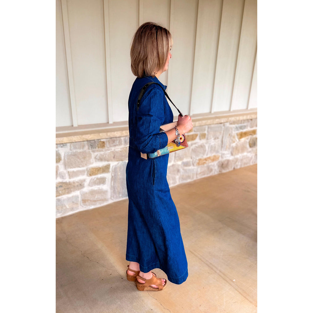Side view of the Uncle Frank indigo Tencel denim shirtwaist dress showing its fluid, flattering drape.