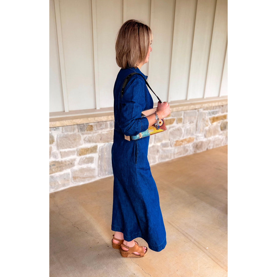 Side view of the Uncle Frank indigo Tencel denim shirtwaist dress showing its fluid, flattering drape.