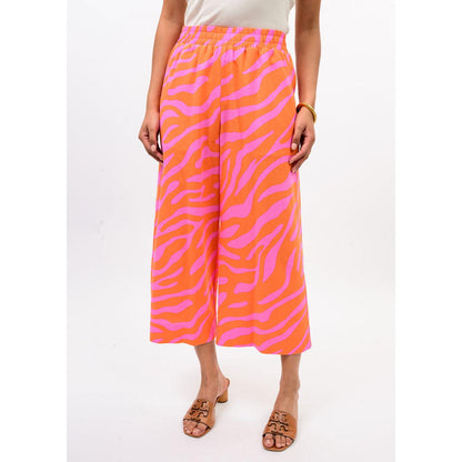 Ivy Jane Pull-on Crop Pant in Tangerine featuring a bold orange and pink zebra print.