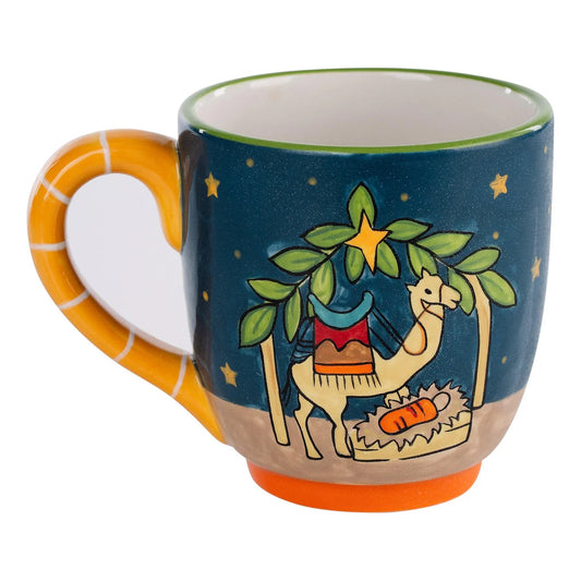 Hand-painted 16 oz ceramic Christmas mug featuring a Nativity manger scene with a camel and baby Jesus.