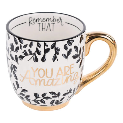 Hand-painted 16 oz "You are Amazing Remember That" ceramic mug with floral patterns and a gold-colored handle.
