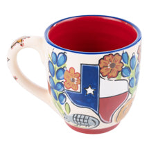 Hand-painted 16 oz ceramic mug featuring the State of Texas shape filled with cacti and flowers on a white polka dot background.