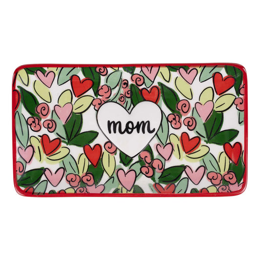 Decorative tray with heart designs and 'mom' text on a white background