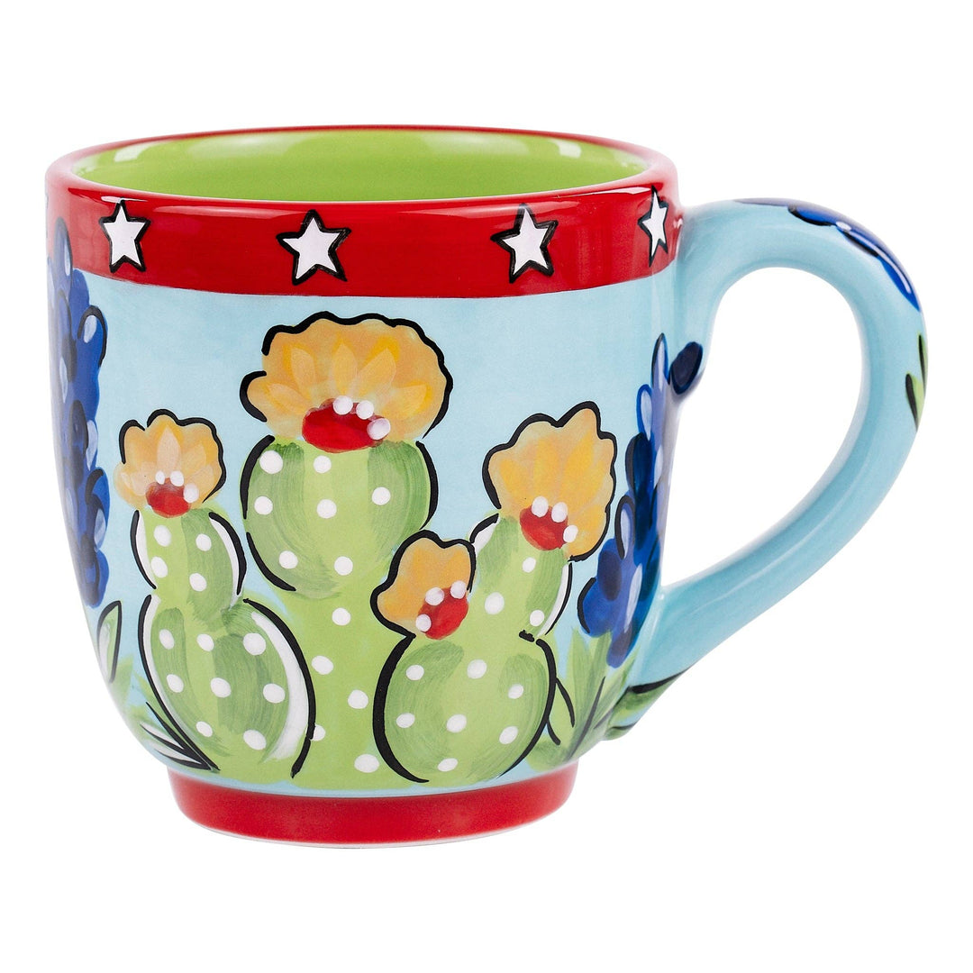 Glory Haus hand-painted 16oz coffee mug featuring Texas wildflowers, cacti, and red trim.