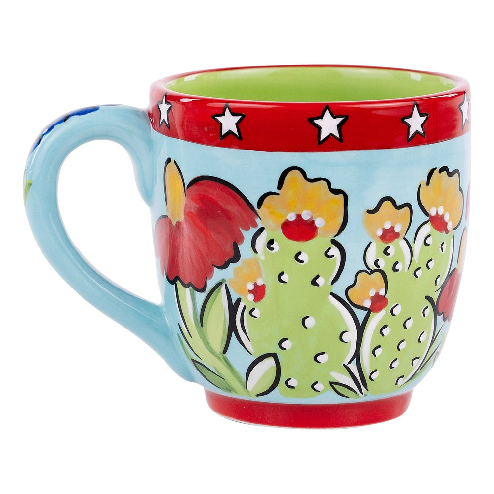 Glory Haus hand-painted 16oz coffee mug featuring Texas wildflowers, cacti, and red trim.