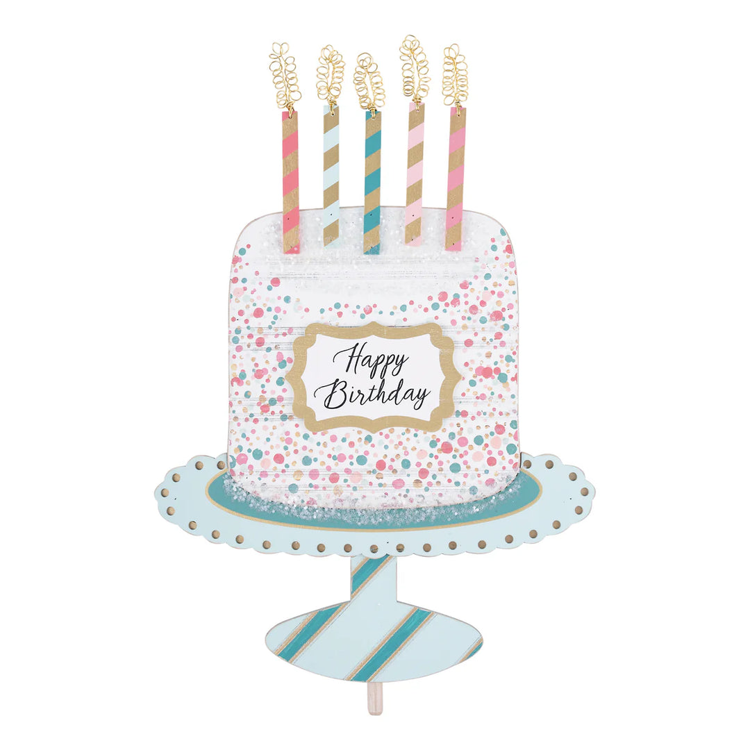 Glory Haus Fancy Happy Birthday Cake Topper displayed on top of a decorated celebratory cake highlighting its original elegant text design.