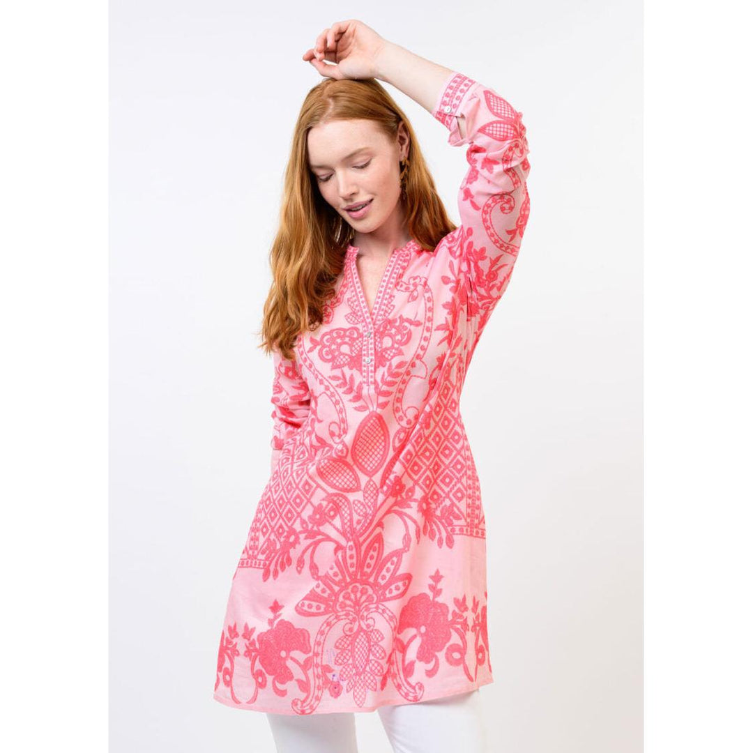 Close-up of the intricate multi-color panel print and pointed collar on the Ivy Jane coral blouse.