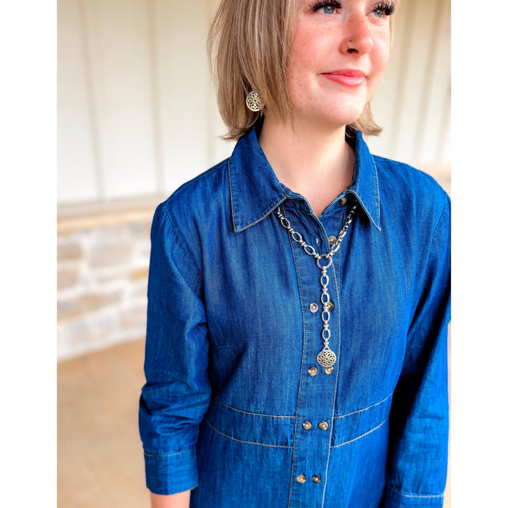 Close-up of the Uncle Frank Tencel denim shirtwaist dress detailing the collar and soft indigo fabric.