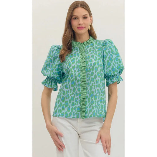 Shop the June Leopard Print Top by Entro. Features a ruffle trim band collar, puff sleeves, and a vibrant green/blue leopard motif in a lightweight woven fabric.