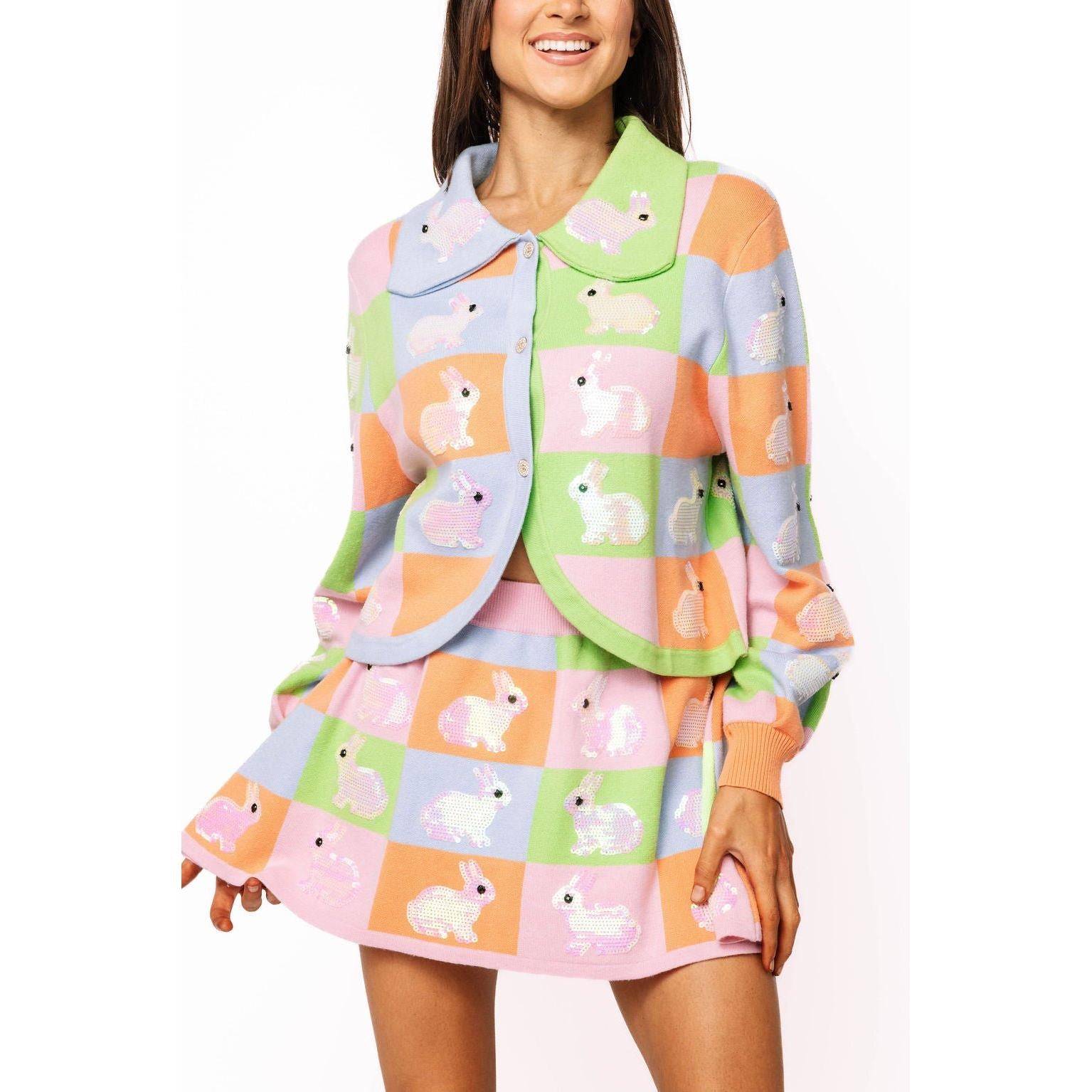 Close-up of the intricate sequin work on the bunny design and the pastel button-up collar.