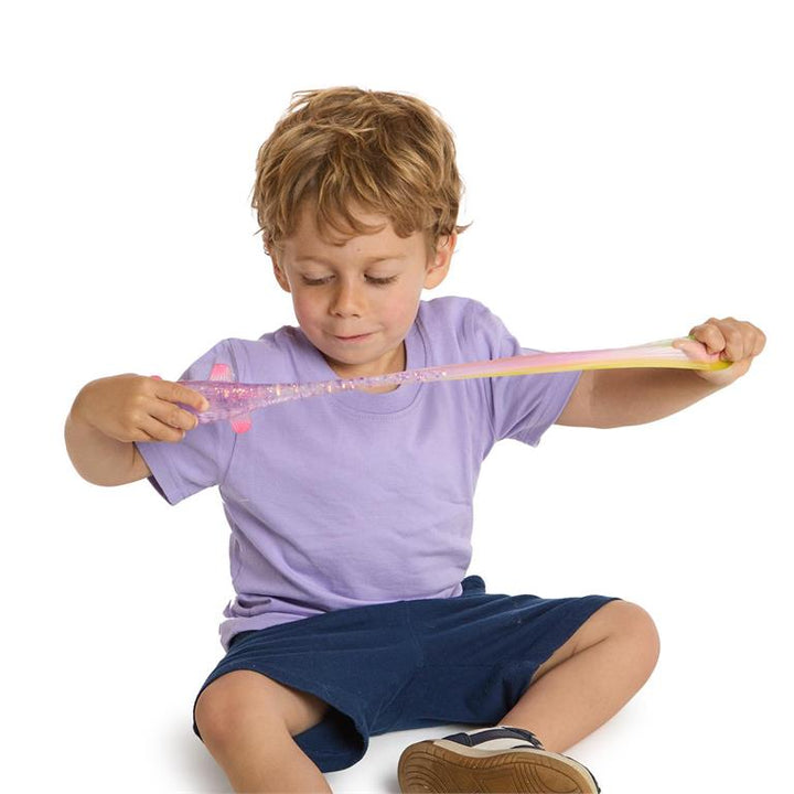 Child playing with a glittery fish.