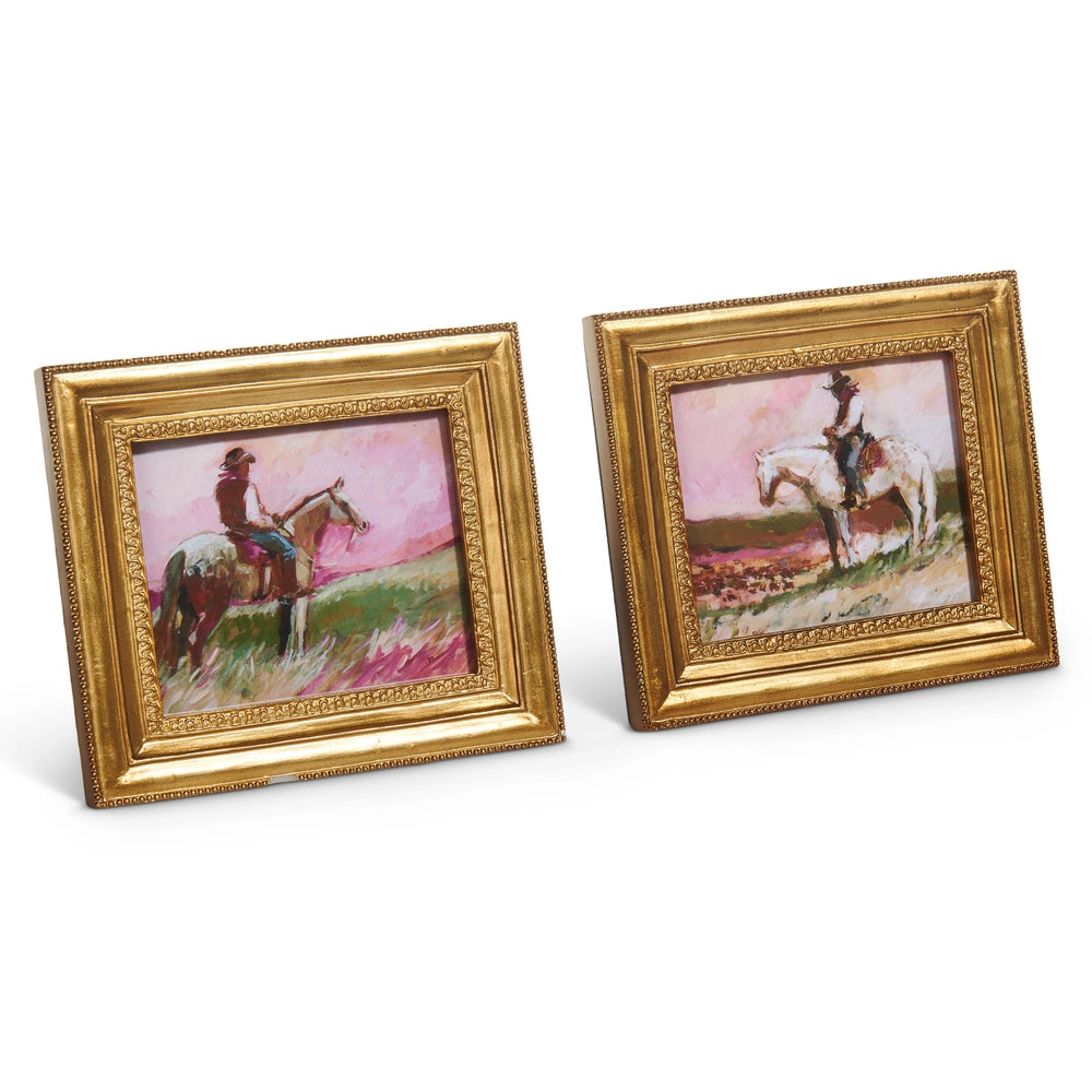 Two framed paintings of a person on horseback with gold frames on a white background