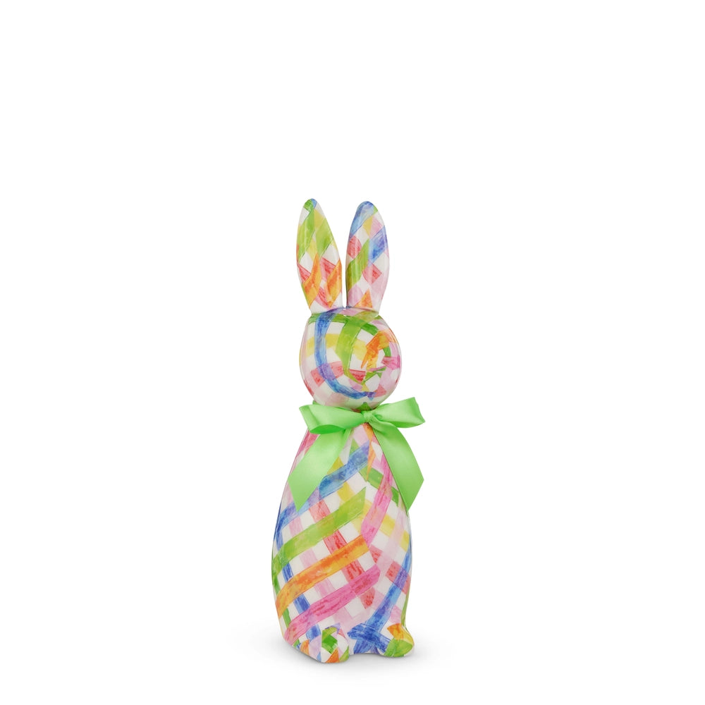 Colorful tie-dye Easter bunny with a green bow on a white background