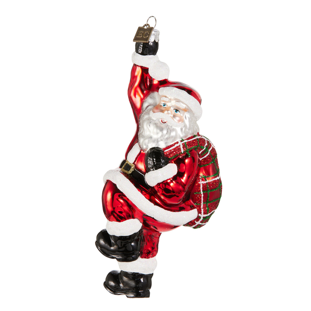 RAZ EC 7" Down the Chimney Ornament featuring a festive Santa climbing down a chimney.