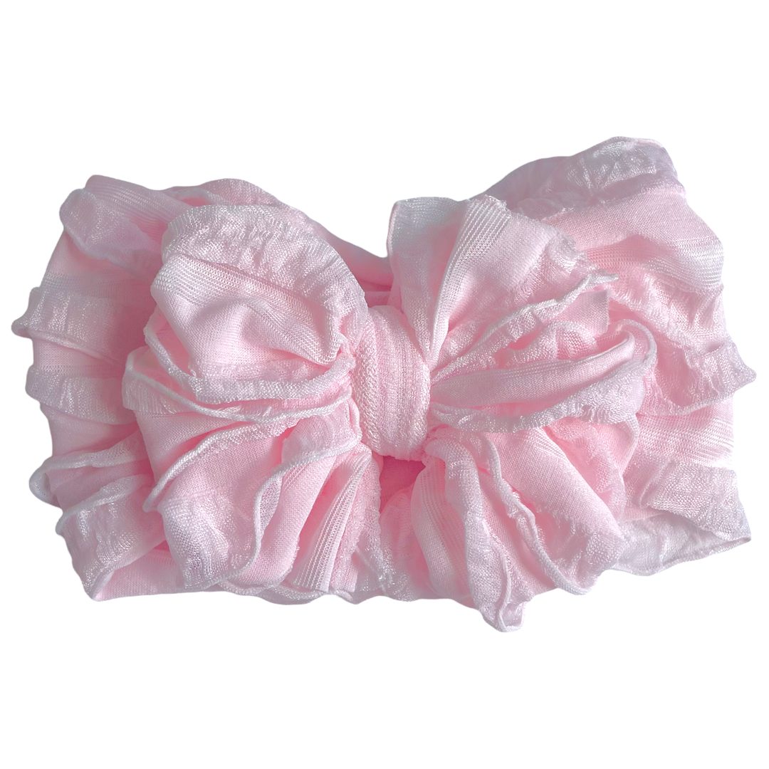 Rockin Royalty Ruffled Headband in Perfect Pink; a soft, stretchy, and textured pink headband for infants and toddlers.