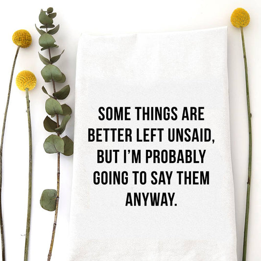 White flour sack tea towel with the humorous phrase "Better Left Unsaid" printed in bold black typography.