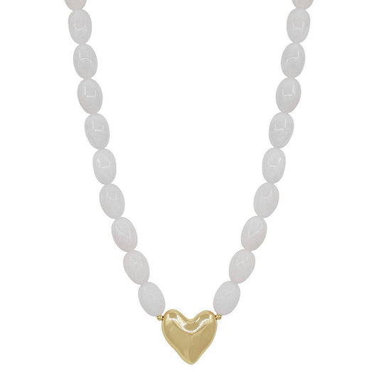 Necklace with white beads and a gold heart pendant on a white background