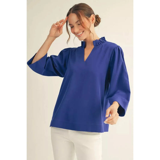 Isla crinkle top in Royal Blue featuring a ruffled V-neck and 3/4 sleeves.