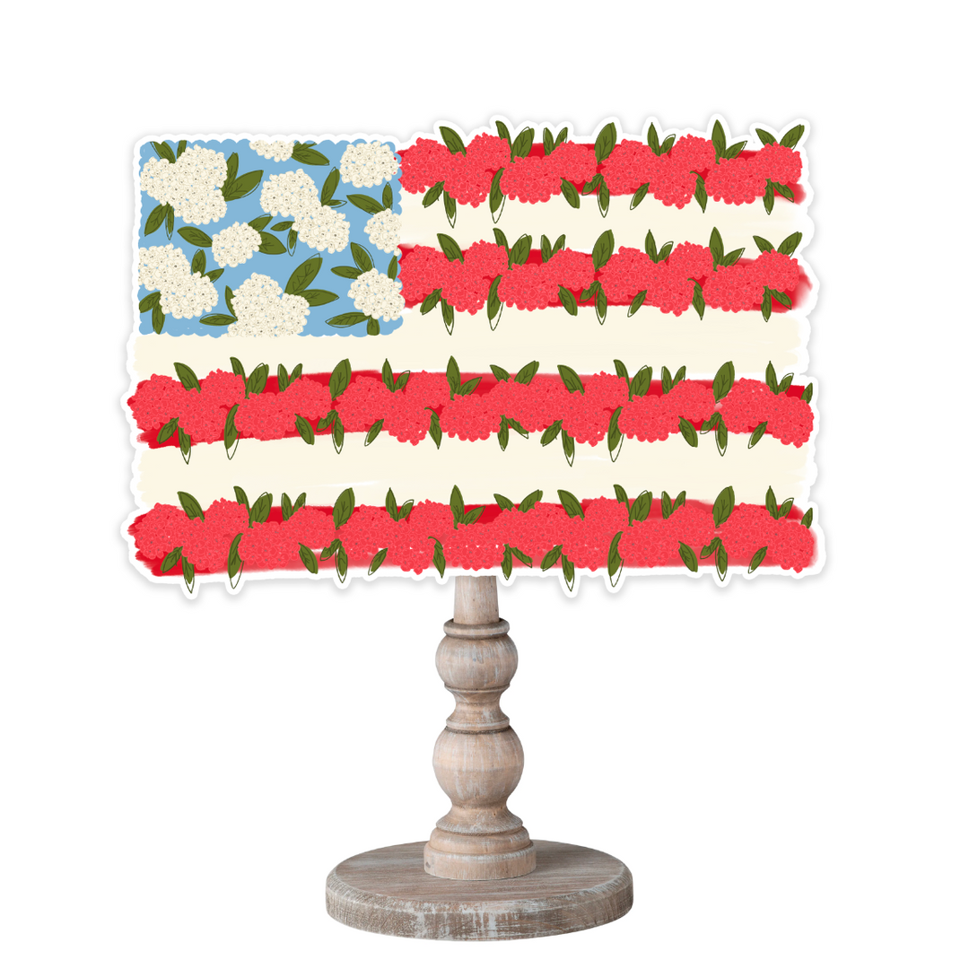 12-inch Flag of Flowers wooden topper featuring red and white floral stripes and a blue star field, designed for interchangeable bases.