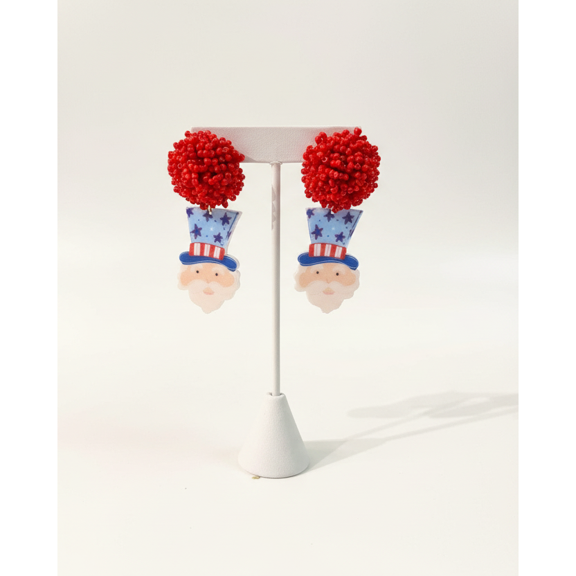 Handcrafted Uncle Sam dangle earrings with vibrant red, white, and blue patriotic details.